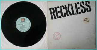 RECKLESS: No Frills LP. a la MAMAS BOYS, KING KOBRA, HELIX. The cover is not dirty, the artwork is like that. Check samples